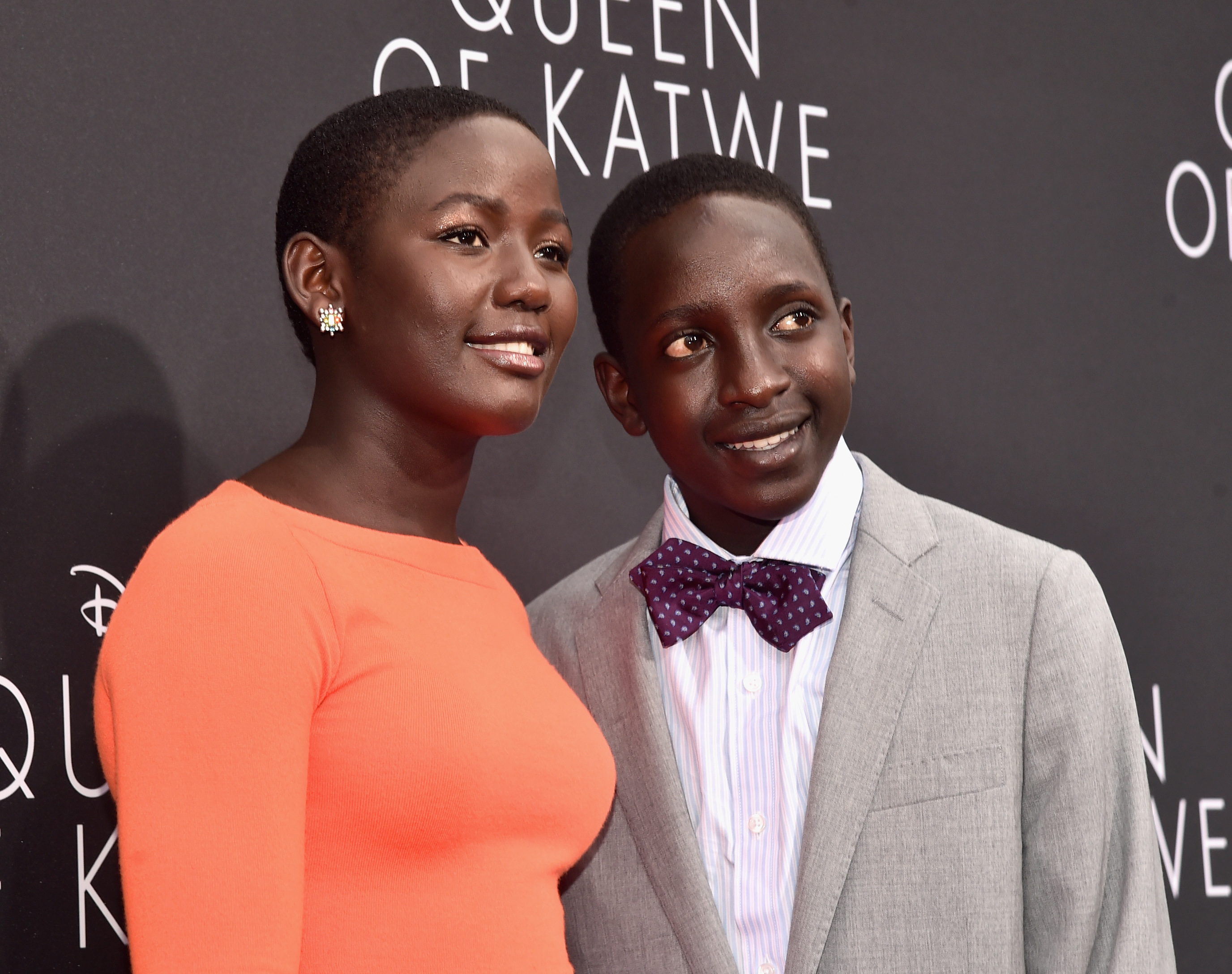 HOLLYWOOD, CA - SEPTEMBER 20: Actors Madina Nalwanga (L) and Martin Kabanza arrive at the U.S. premiere of Disneys Queen of Katwe at the El Capitan Theatre in Hollywood. The film, starring David Oyelowo, Oscar winner Lupita Nyongo and newcomer Madina Nalwanga, is directed by Mira Nair and opens in U.S. theaters in limited release on September 23, expanding wide September 30, 2016. On September 20, 2016 in Hollywood, California. (Photo by Alberto E. Rodriguez/Getty Images for Disney) *** Local Caption *** Madina Nalwanga; Martin Kabanza